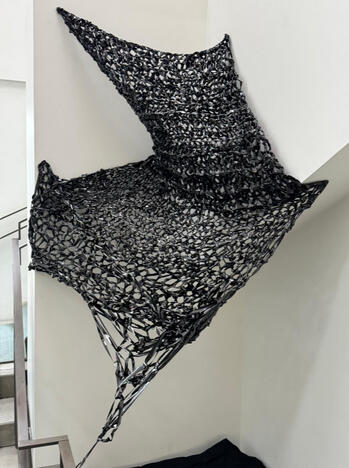 &quot;Home Comforts I,&quot; 2025. Crocheted VHS tape, varied dimension.