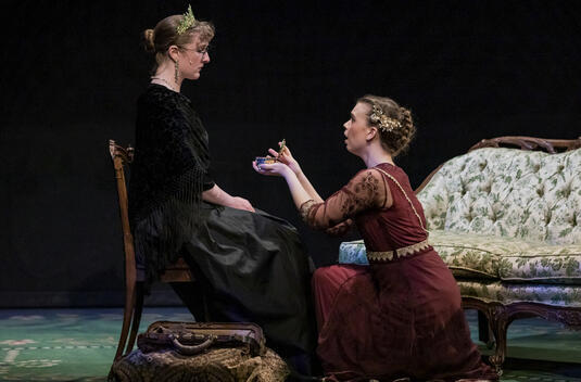 Actors: Olivia Widmer, Josephine Partridge; Props: Hotel Chair, Carpet Bag, Music Box, Loveseat