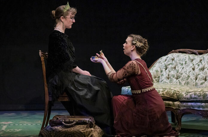 Actors: Olivia Widmer, Josephine Partridge; Props: Hotel Chair, Carpet Bag, Music Box, Loveseat